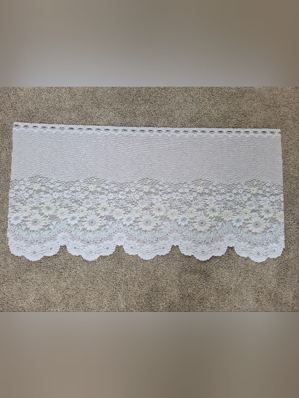 White and pastel accented floral lace fabric piece